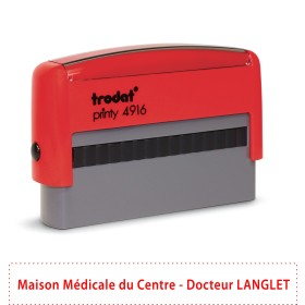 Tampon rouge et gris Tamry de bureau, modèle Trodat Printy 4916, posé sur fond blanc.